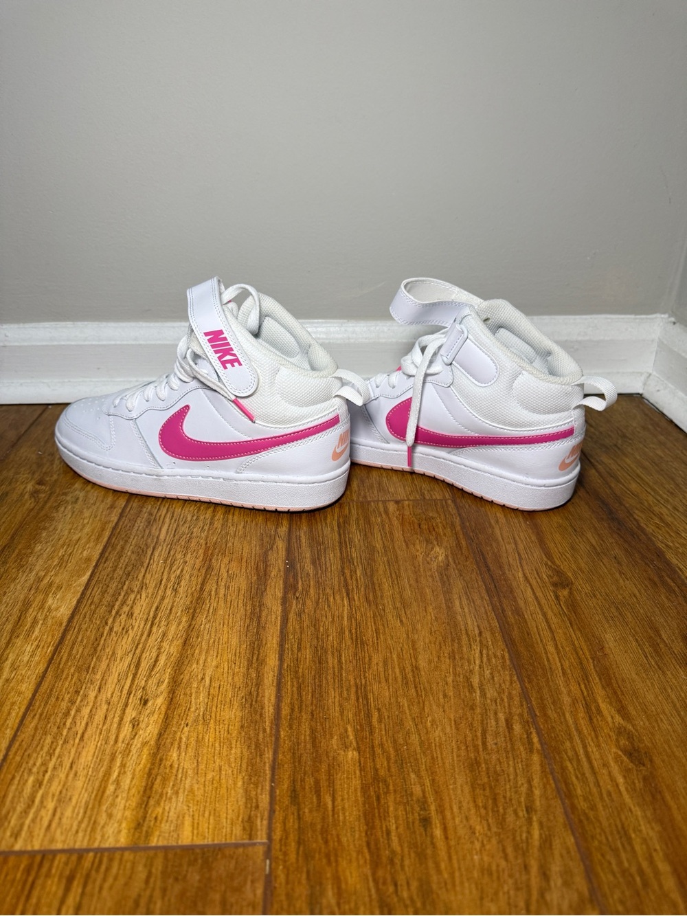 Nike White High-Top Sneakers with Pink Accents